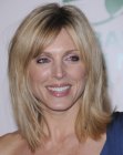 Marla Maples wearing versatile mid-length hair that tips the shoulders