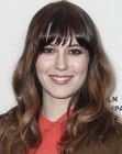 Mary Elizabeth Winstead wearing her hair long with blunt cut bangs and curls