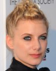 Mélanie Laurent rocking a tight updo with curls