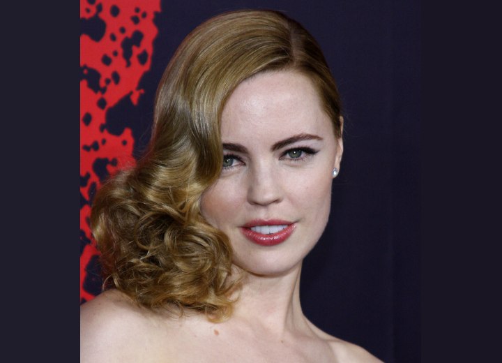 Melissa George's hair styled for an old Hollywood glamour look with curls