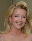 Melody Thomas Scott sporting shoulder length hair