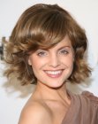 Mena Suvari's short hairstyle with round bangs that flip up