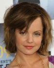 Mena Suvari wearing her hair layered and midway her neck