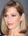 Meredith Monroe sporting a medium length above the shoulders hairstyle with a rounded shape
