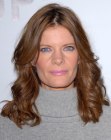 Michelle Stafford aged over 40 and wearing her hair long with curls