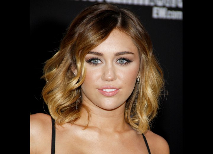Miley Cyrus with blonde shoulder length hair