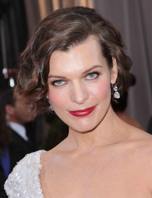 Milla Jovovich with her short hair styled for a retro look