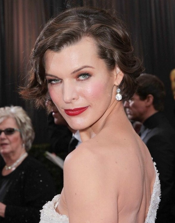 Milla Jovovich with her short hair styled for a retro look