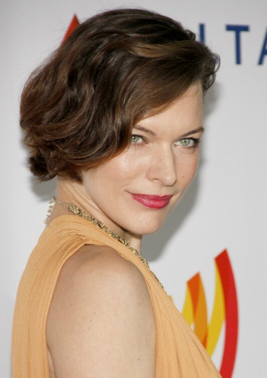 Milla Jovovich with her hair cut in an asymmetrical short bob