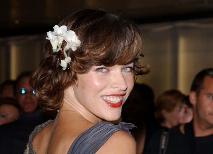 Milla Jovovich with flowers in her hair