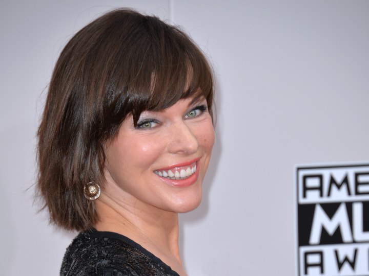 Milla Jovovich - Sleek short haircut with helmet like shape