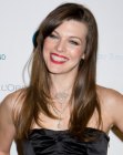 Milla Jovovich wearing her hair long and styled for volume and movement