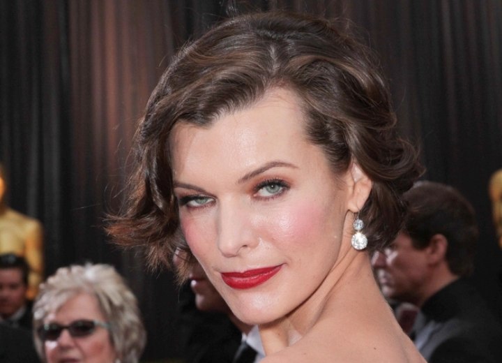 Milla Jovovich with a short wavy retro hairdo