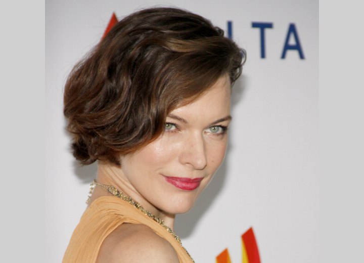 Milla Jovovich - SHort hairstyle with a long diagonal fringe