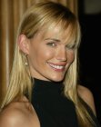 Molly Sims with her blonde hair cut to one length below the shoulders