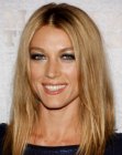 Natalie Zea sporting long middle-parted hair with angled sides