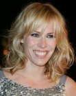 Natasha Bedingfield's medium length hairstyle with textured ends and bangs