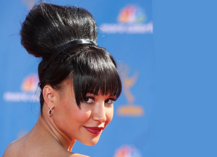 Naya Rivera wearing her black hair in a bulbous updo