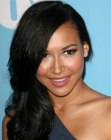 Naya Rivera's uncomplicated look with her long hair styled to one side