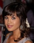 Nicole Anderson sporting a semi-upstyle with a flower hair accessory