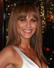 Nicole Ari Parker wearing her hair long and sleek with bangs