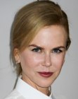 Nicole Kidman with her hair styled for a business look with a ponytail