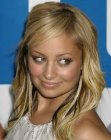 Nicole Richie with her blonde hair cut into a long layered style