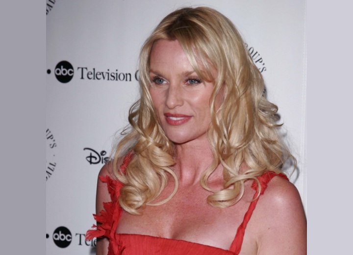 Nicollette Sheridan with curls nestling around the shoulders