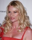 Nicollette Sheridan's long hair with layers and glossy curls