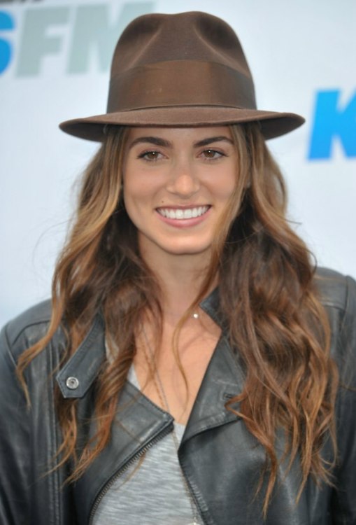 Nikki Reed's hippie look with chest length hair, hat and 