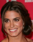 Nikki Reed's updo with a plaited bun