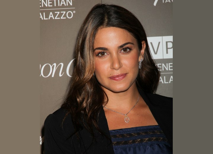 Nikki Reed with her hair tucked behind the ear