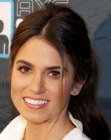 Nikki Reed wearing her hair in a casual style with a long ponytail