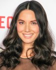 Olivia Munn's long curly hair with hairglaze