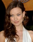 Olivia Wilde with her long hair styled into smooth curls