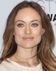 Olivia Wilde sporting long brown hair with blonde highlights