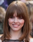 Ophelia Lovibond wearing her brown hair in a long bob with bangs