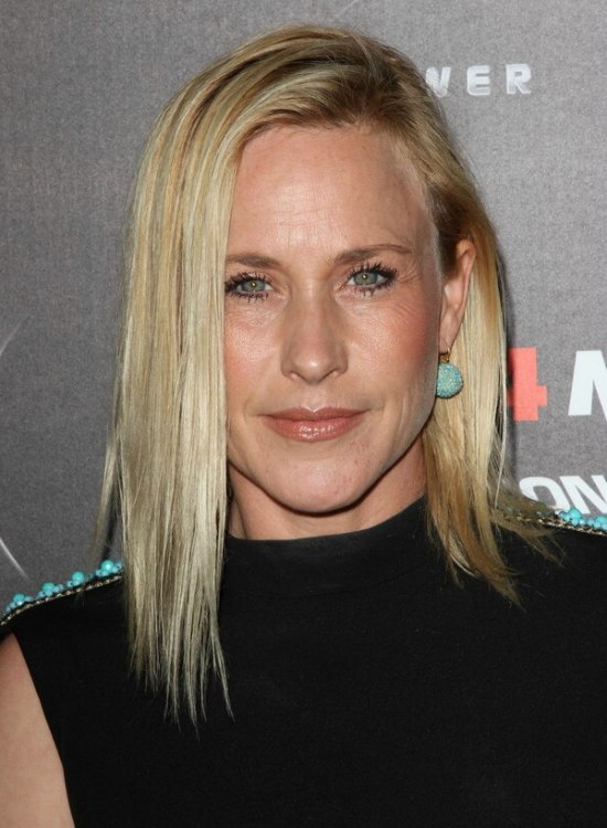 Patricia Arquette with long straightened hair tucked 