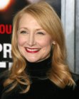 Patricia Clarkson's reddish blonde hair with curled ends