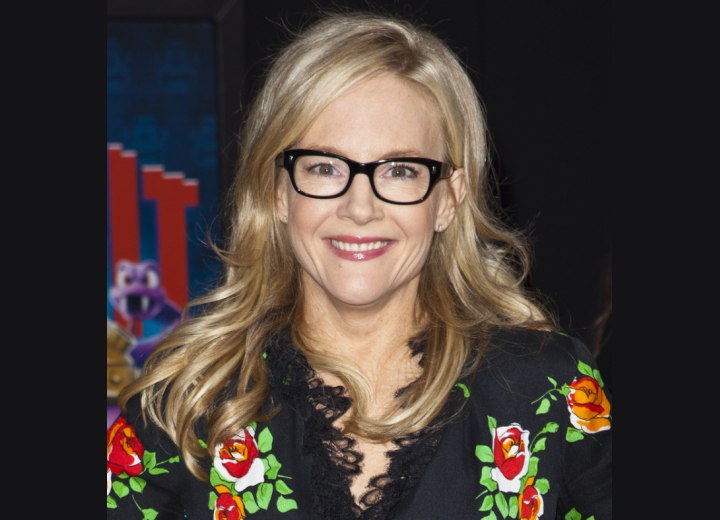 Rachael Harris wearing her hair long with curls across the shoulders