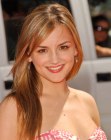 Rachael Leigh Cook sporting long hair with layers and subtle highlights