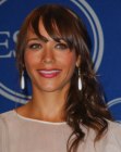 Rashida Jones with her long hair brushed over one shoulder