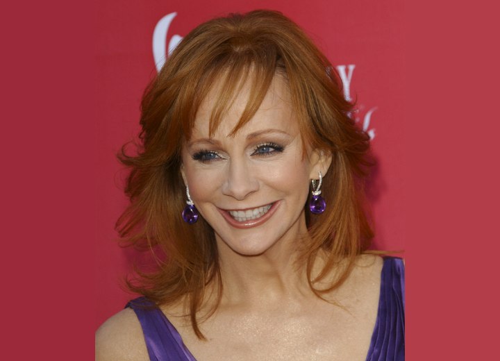 Redhead Reba McEntire wearing her hair long