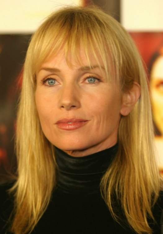 Turtlenecked Rebecca de Mornay with long sunny blonde hair 
