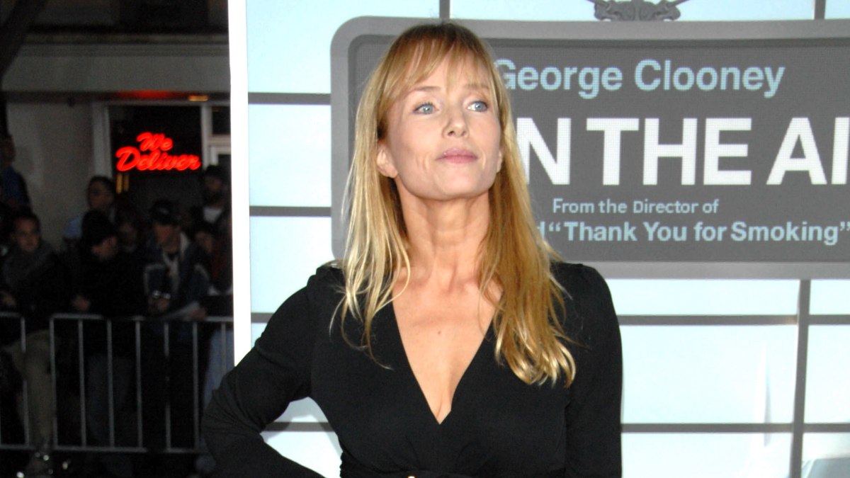 Rebecca de Mornay with long hair and bangs that fall just 