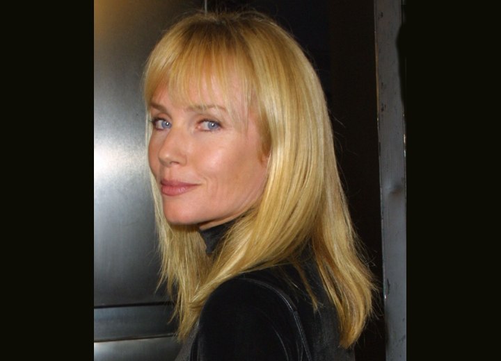 Side view of Rebecca de Mornay's long hairstyle