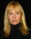 Rebecca de Mornay's long hair with razor cutting and eye length bangs