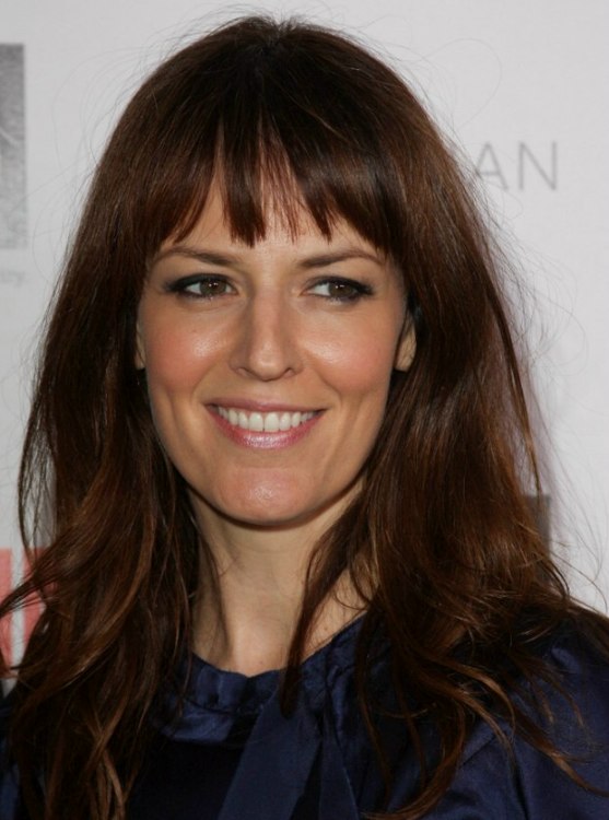 Rosemarie DeWitt wearing a natural long hairstyle that 