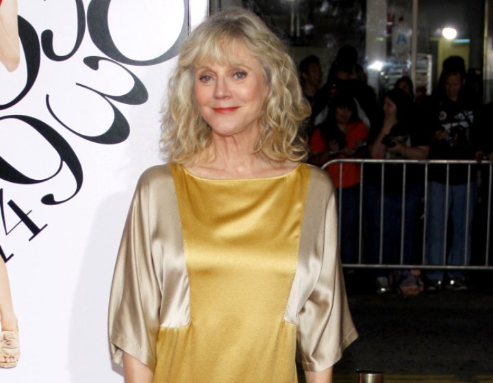 Blythe Danner wearing a silk boat-necked blouse