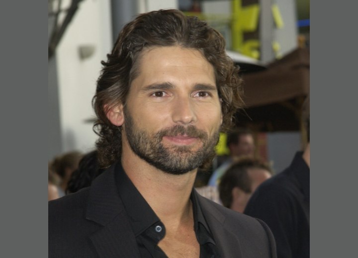 Eric Bana with long curly hair and a beard